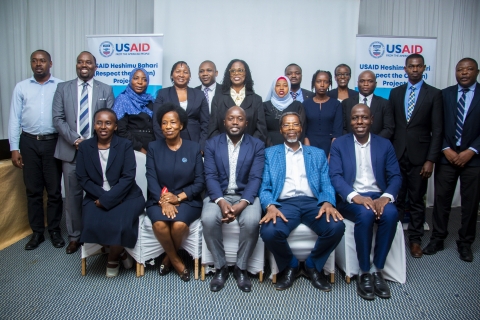 In the picture, a group of training participants is gathered for the "Training on Marine Conservation Laws’ Compliance and Marine Biodiversity/Wildlife Crime Enforcement." The participants represent various key organizations, including the Ministry of Fisheries and Blue Economy, magistrates, officers from the Directorate of Criminal Investigations (DCI), representatives from the Director of Public Prosecutions (DPP), members of the Tanzania Police Force, Regional Fisheries Officers, Council Fisheries Office
