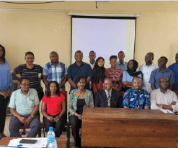 Acting Vice Chancellor for Hurbet Kairuki Memorial University, Professor Godwin Ndossi (seated on the center), officiating a four-days Research Fellow’s training for an HIV prevalence study in Nyarugusu and Nduta refugees camps in Kigoma Tanzania.